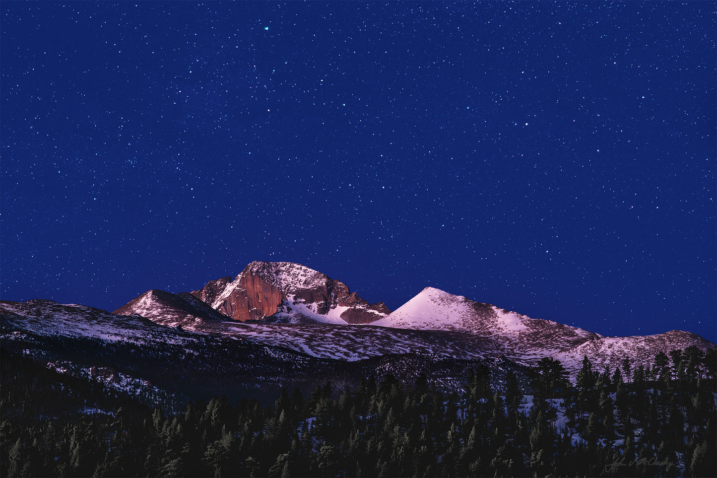 While waiting for a dawn shot, I was blown away by the way the horizon's first light lit Long's Peak and the foreground pines while yet allowing the stars to glow in the dark sky. This composite fine art landscape photography print recreates my awe at that sight.