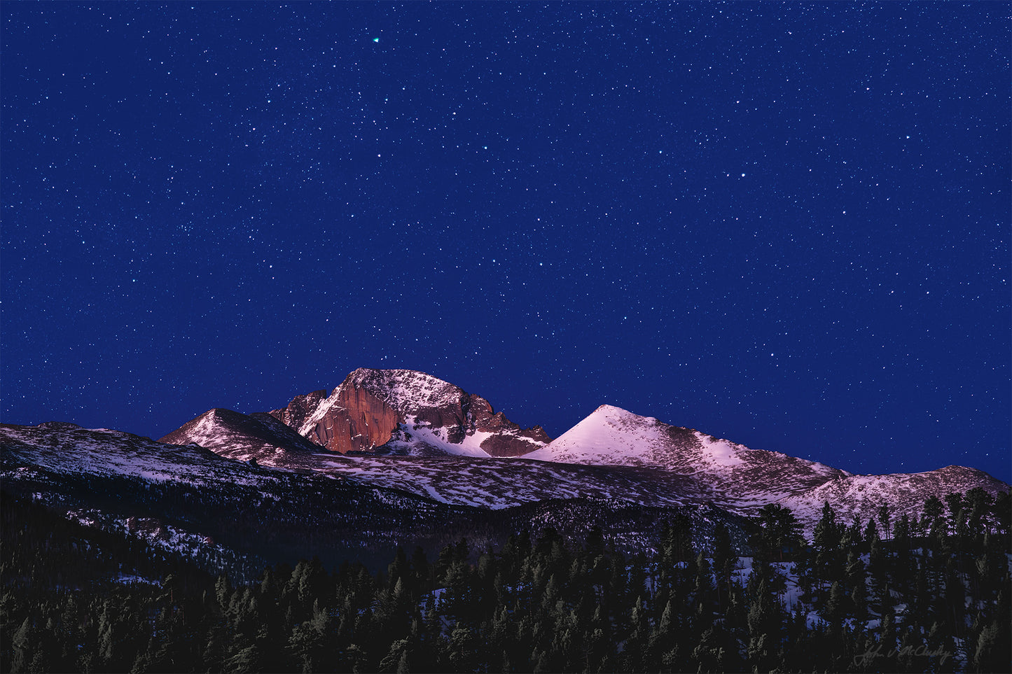 While waiting for a dawn shot, I was blown away by the way the horizon's first light lit Long's Peak and the foreground pines while yet allowing the stars to glow in the dark sky. This composite fine art landscape photography print recreates my awe at that sight.