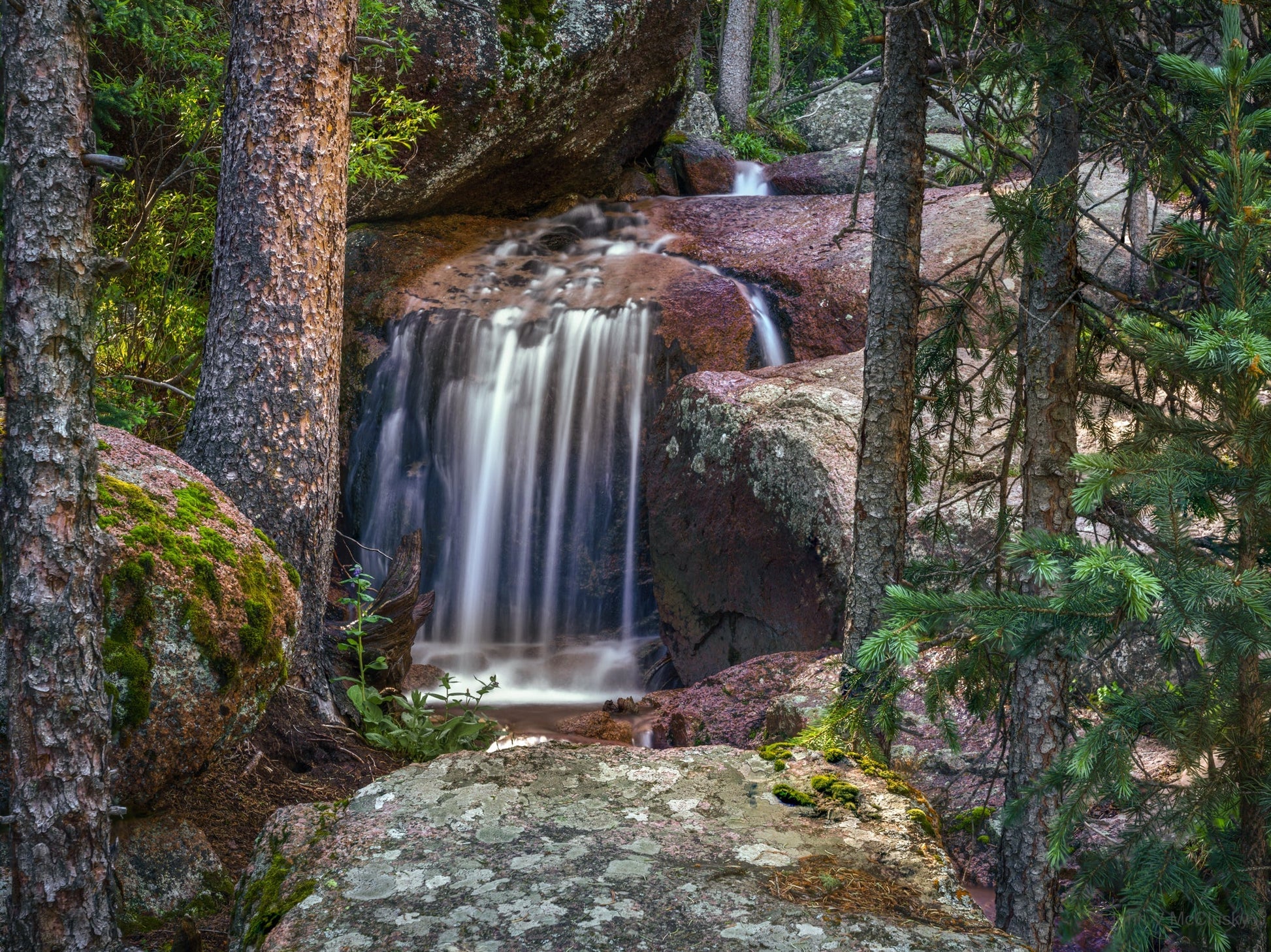 Horsethief fall peaking between the trees and granite boulders. I loved the light on the scene, and the simple lines of the water mirrored by the tree trunks; a beautiful fine art nature image!